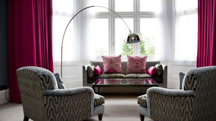 Grey Designing Sofa Set And Pink Curtains In Room